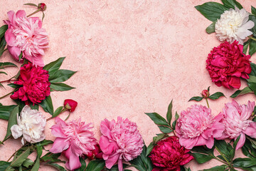 Abstract floral frame layout with copy space for text. Peonies on pink background. Romantic composition, flat lay, top view