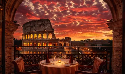 Fototapeten A panoramic view restaurant with the Colosseum as a backdrop, romantic dinner for two © piai
