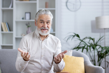 Fototapeta premium Senior man engaging in a video call from home