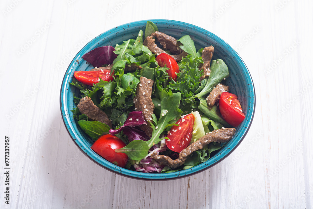 Wall mural healthy salad with beef cherry tomatoes