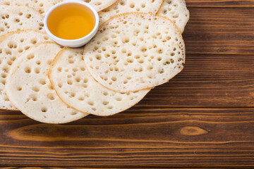 Moroccan traditional eating . Pancakes with honey