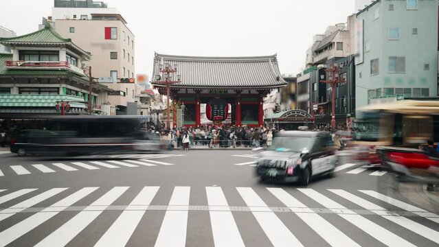 4K Time lapse of Many tourists walk across a zebra crossing in Asakusa, Japan. Sensoji temple (Asakusa Kannon Temple)