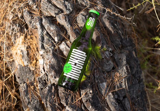 Bottle Laying on Tree Mockup