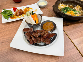 Close up and selective focus dish of delicious charcoal grilled buta hoho steak at Japanese...