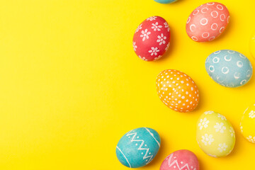 Fototapeta na wymiar Easter eggs on a bright background. Easter celebration concept. Colorful easter handmade decorated Easter eggs. Place for text. Copy space.