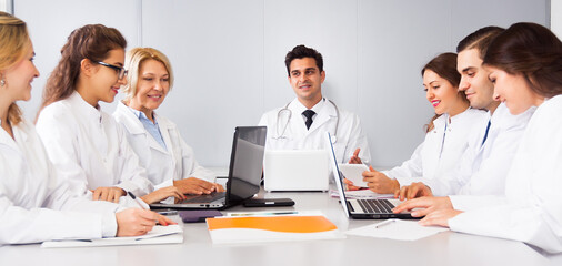 Meeting of doctors in the conference room at the table