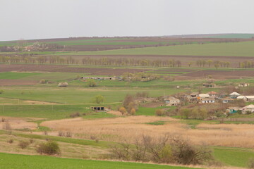 A landscape with a road and houses