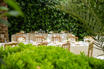 White color wedding table decorated with decorative and elegant for wedding. There are flowers,...