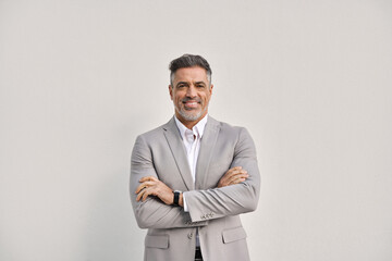 Happy middle aged business man ceo entrepreneur in suit, smiling 45 years old professional executive manager, confident businessman looking at camera standing arms crossed isolated on white, portrait. - 777389367