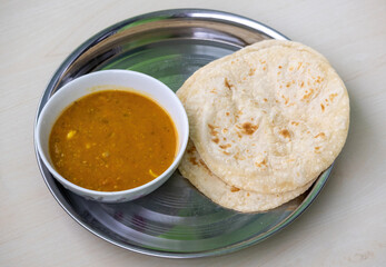 Bengali's most popular meal Dal and Roti in a dish. Traditional food from Bangladesh and India....
