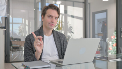 Fototapeta premium Young Man in Denial while Working in Office
