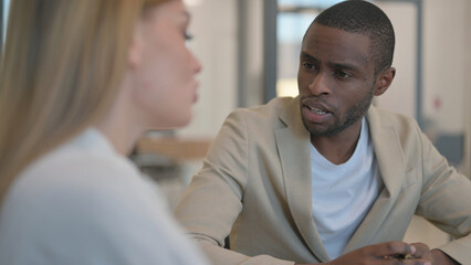 Fototapeta premium Close up of African Man Talking with Woman