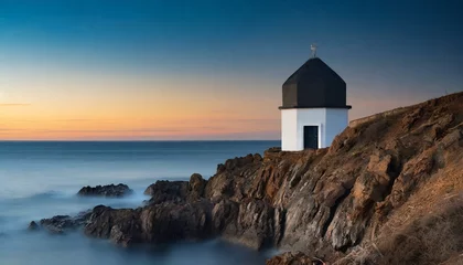 Tuinposter lighthouse at sunset © Danmarpe