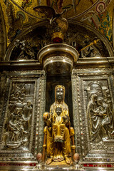 Fototapeta na wymiar Montserrat monastery, Catalonia, Spain. Our Lady black madonna statue in the church sanctuary