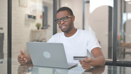 African American Man Upset with Online Shopping Failure