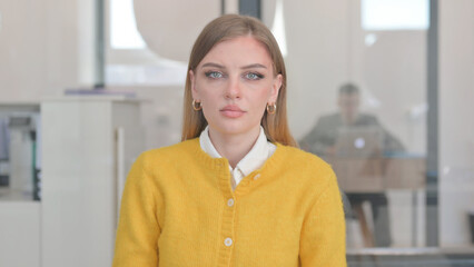 Portrait of Serious Young Woman in Office