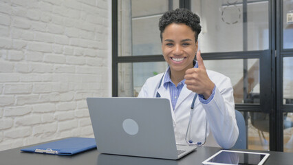 African Female Doctor Showing Thumbs Up in Clinic
