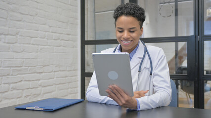 African Female Doctor Doing Video Chat on Tablet