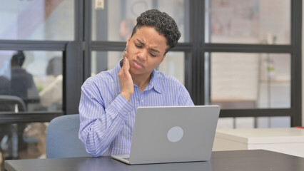 Mixed Race Woman having Toothache while Using Laptop