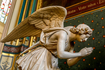 Saint Gervais-Saint Protais catholic church, Paris, France. Praying angel statue by sculpted by...