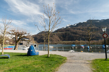 Lake promenade in an alpine scenery at the lake Walensee in Weesen in Switzerland