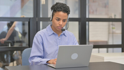 Call Center Mixed Race Woman Working on Laptop