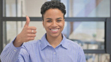 Portrait of African Woman with Thumbs Up