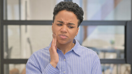 Portrait of African Woman with Tooth Pain in Office