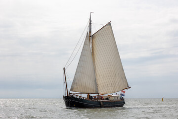 Traditional old wooden flat bottomed boat on the World Heritage Wadden Sea, the Netherlands. Calm...