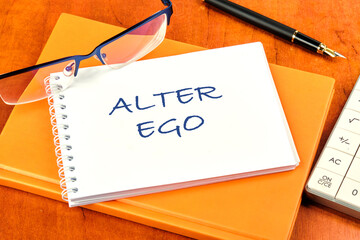 Text Alter ego is translated from Latin as the second self. a real or invented alternative personality of a person. Written on a clean white notebook