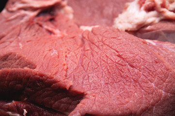 Close-up of a piece of fresh beef meat in shallow depth of field
