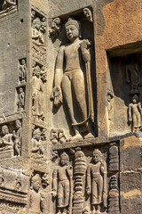Ajanta caves, a UNESCO World Heritage Site in Maharashtra, India. Statues on porch of the entrance facade of cave 19