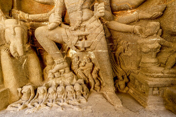 Ellora caves, a UNESCO World Heritage Site in Maharashtra, India. Shiva killing the demon Andhaka at the entrance to the Kailasa (Kailash) temple complex - obrazy, fototapety, plakaty