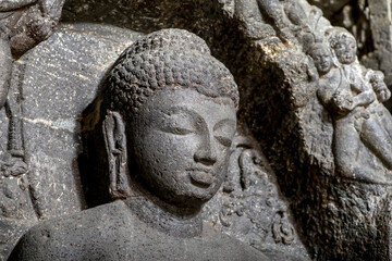 Ellora caves, a UNESCO World Heritage Site in Maharashtra, India. Cave 10.  Teaching Buddha (detail) - obrazy, fototapety, plakaty