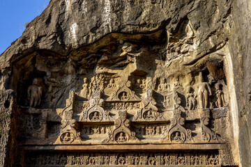 Ellora caves, a UNESCO World Heritage Site in Maharashtra, India. Reliefs carves on the side of the facade of the grand Caitya Cave 10, also called the Visvakarma Caitya Hall