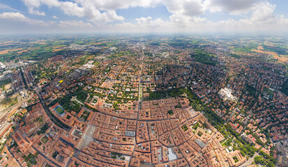 Modena, Italy. Historical Center. Panorama of the city on a summer day. Sunny weather with clouds....