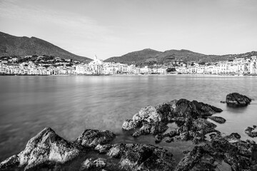 Long exposure landscape of Cadaques seaside village shoreline in Catalonia, Spain on the Mediterranean Sea riviera in black and white - 777428344