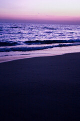 Beautiful sunset on the beach in the evening. Toned.