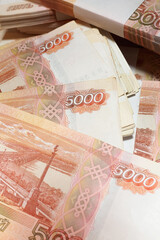 Vertical photo, Russian money, five thousand bills close-up, business concept. 