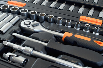A manual set of tools for car repair and maintenance. Close-up, selective focus.