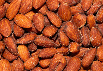 close up with many roasted and salted almonds