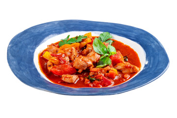 Roast chicken stew with vegetables and tomatoes served in a plate on a white background. Chakhokhbili made from chicken pieces, Georgian cuisine