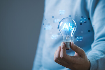 Businessman holding light bulb, brain icon of artificial intelligence, Futuristic business...