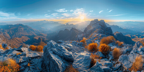 The sun shines on the top of mountain, overlooking a wide view of mountains and valleys below.sunset in the mountains, sunrise in the mountains