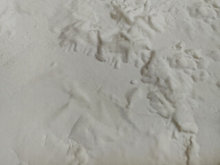 white old building wall surface texture background. the paint layer is peeling and bubbling. damp walls