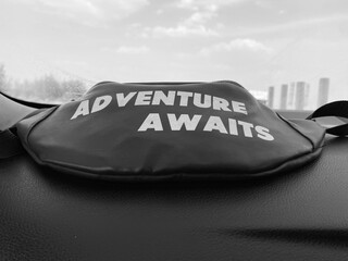 Black Waist bag with adventure awaits quote written