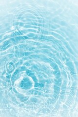 Bluewater waves on the surface ripples blurred. Defocus blurred transparent blue colored clear calm water surface texture with splash and bubbles. Water waves with shining pattern texture background.	