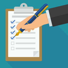 A hand with a pen ticks a checklist placed on a clipboard in flat design style