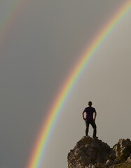 Man looking at the rainbow.