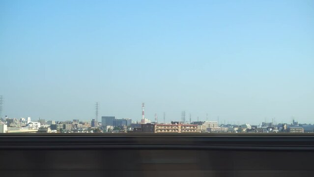 view of modern buildings from moving fast train window, Japan, copy space